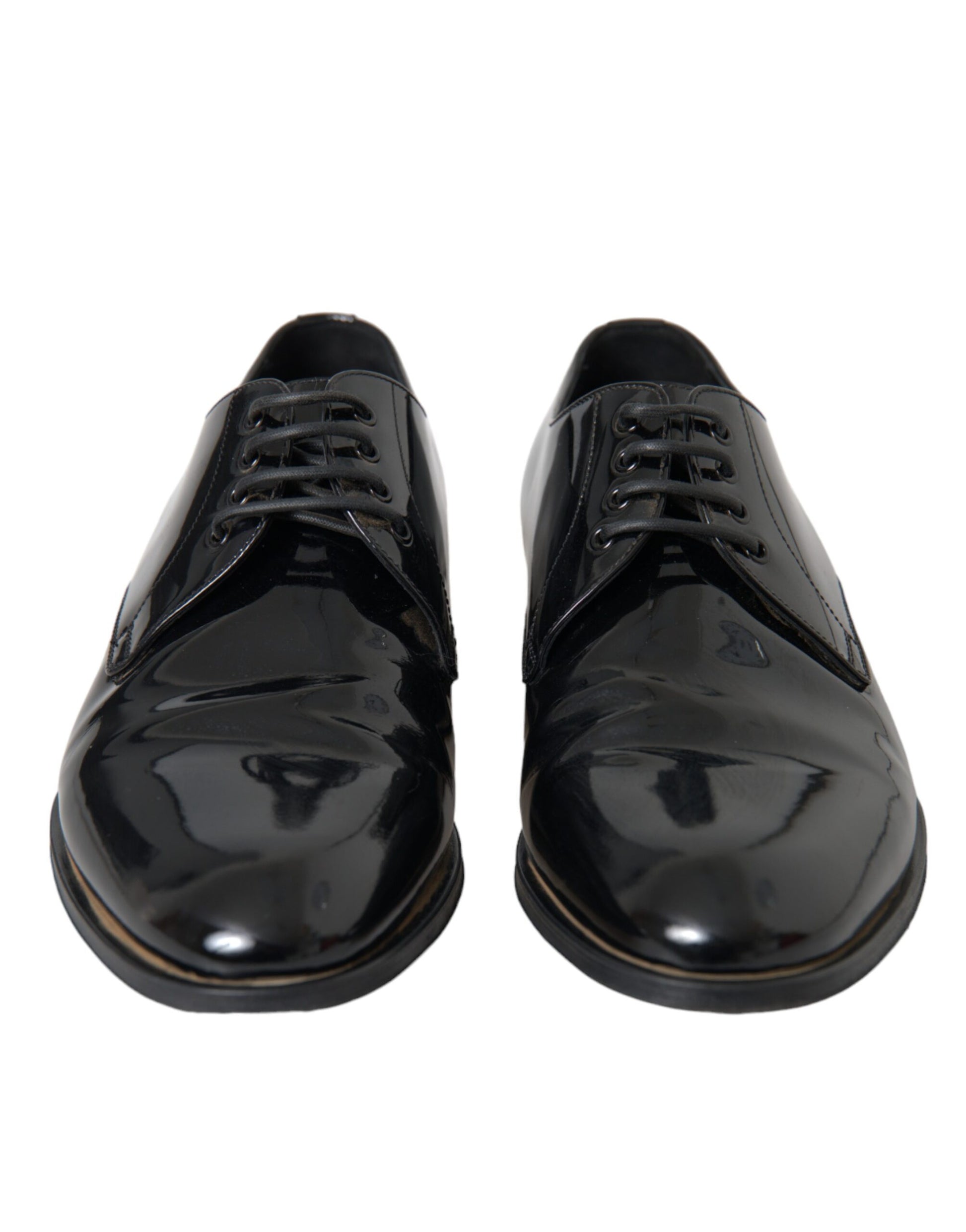 Pair of black patent leather dress shoes with laces and a shiny finish
