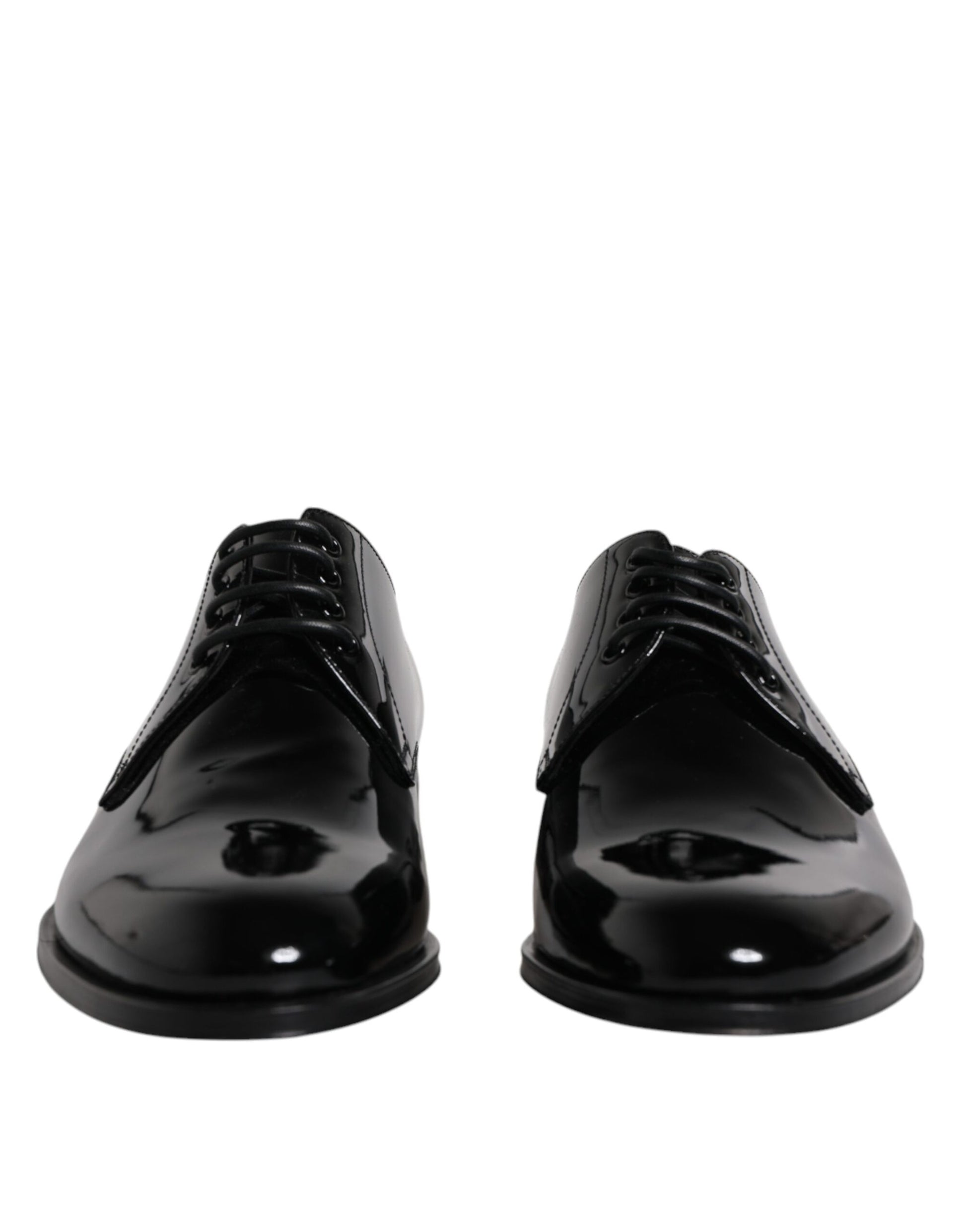 Pair of black patent leather dress shoes with laces and a shiny finish