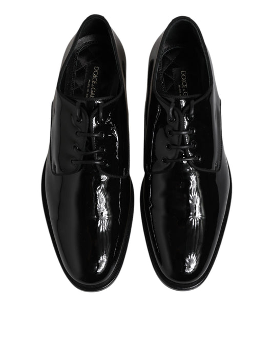 Pair of black patent leather dress shoes with laces and a shiny finish