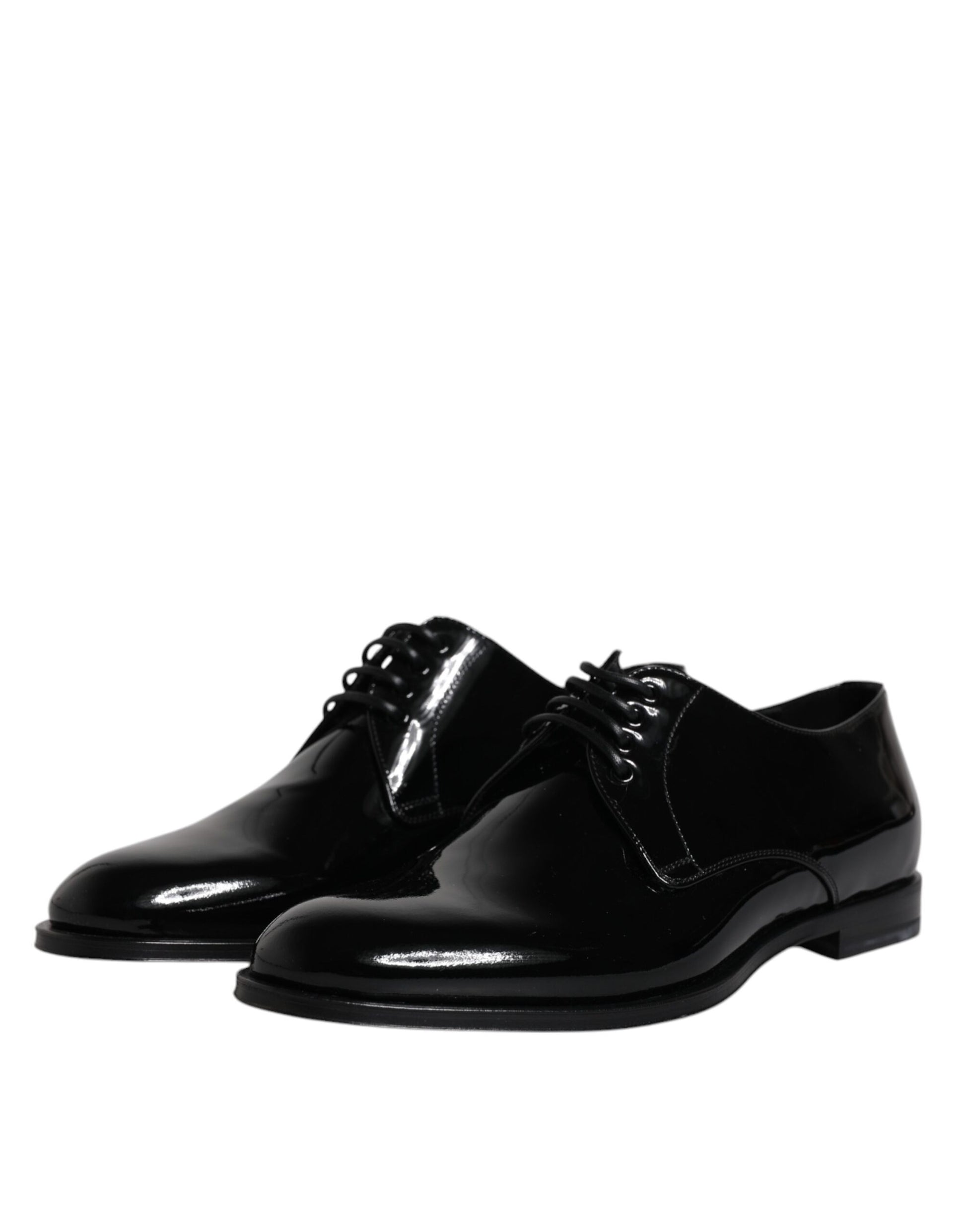 Pair of black patent leather dress shoes with laces and a small heel