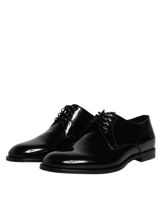 Pair of black patent leather dress shoes with laces and a small heel