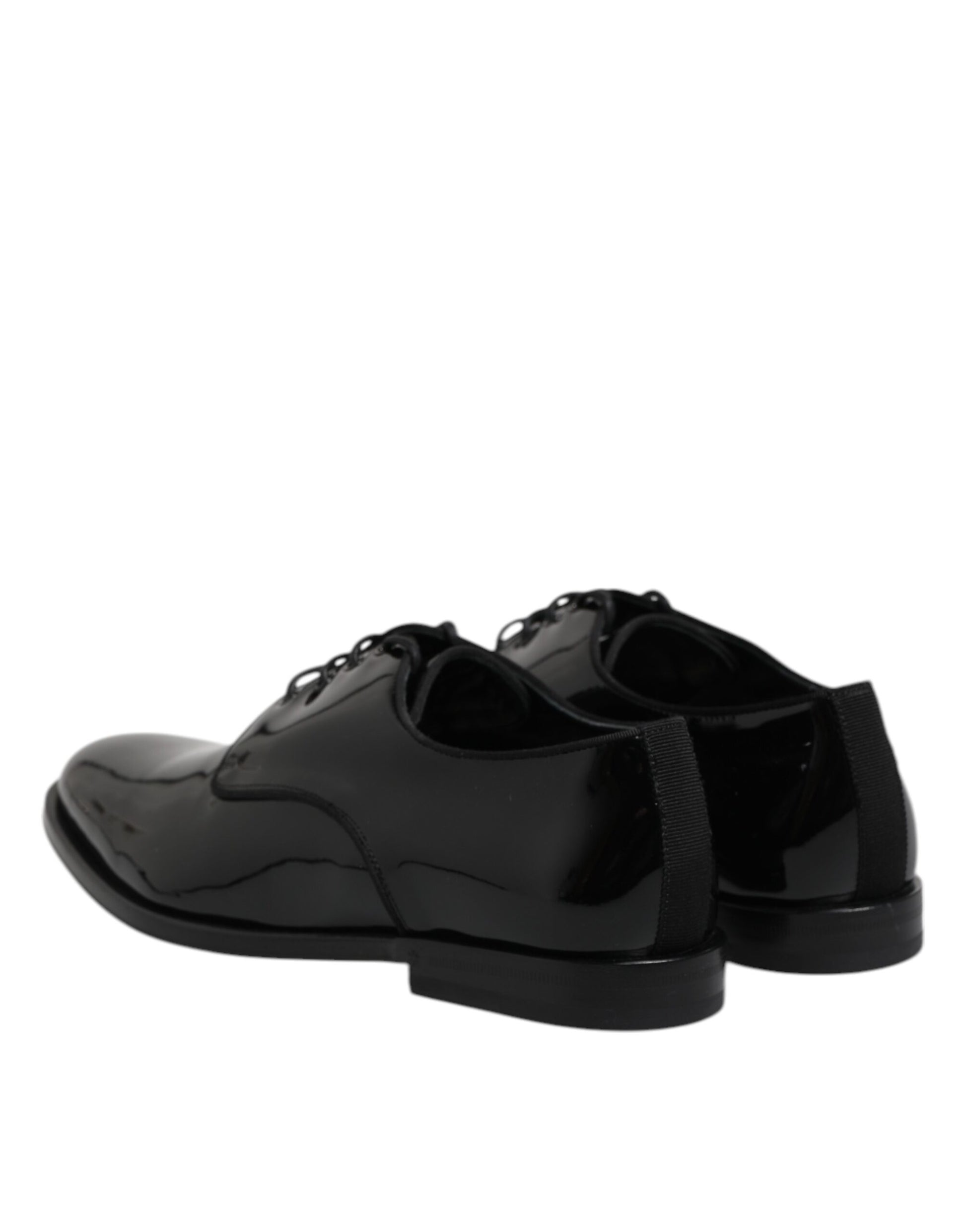 Pair of black patent leather dress shoes with laces and a small heel