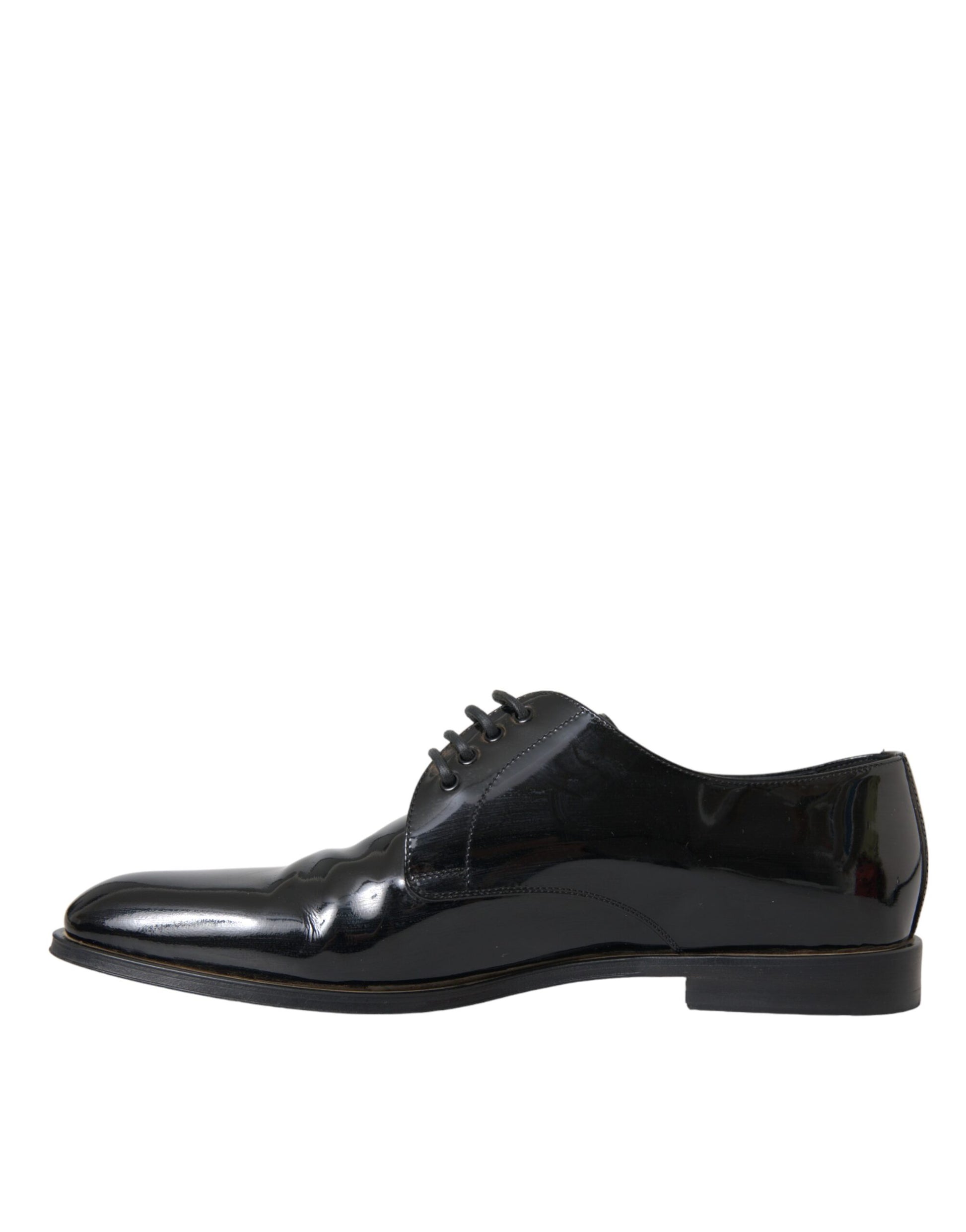 A pair of black patent leather dress shoes with a shiny finish, featuring a lace-up design and a low heel