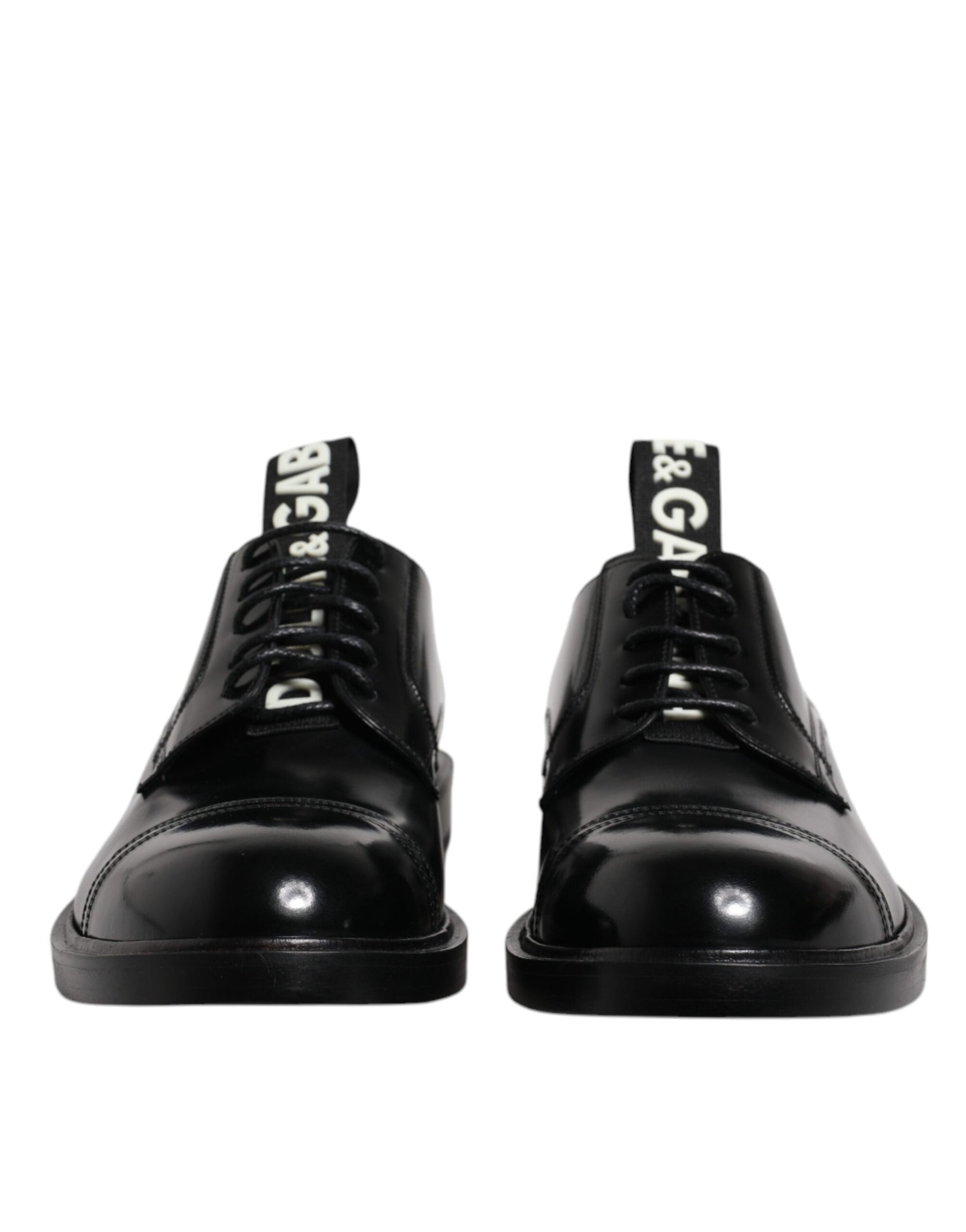 Pair of black patent leather dress shoes with laces, featuring a shiny finish and a brand logo on the side