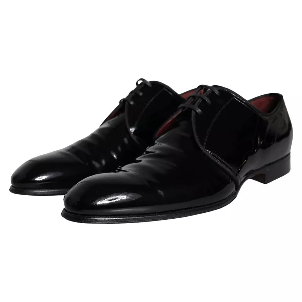 Pair of black patent leather dress shoes with laces and a small heel, by Dolce & Gabbana