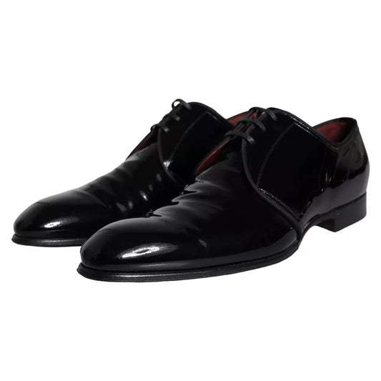 Pair of black patent leather dress shoes with laces and a small heel, by Dolce & Gabbana