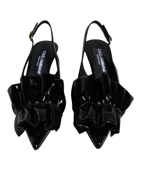 Pair of black high heel shoes with ruffled detailing