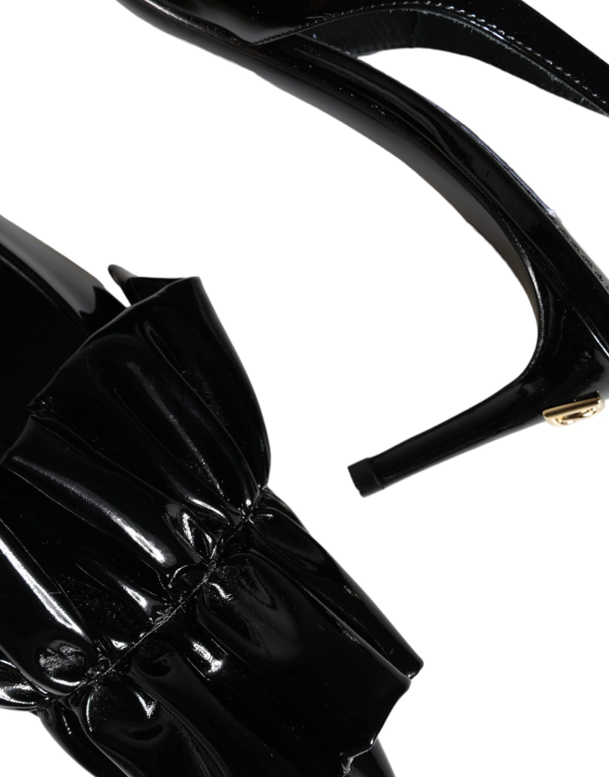 Black high heel shoe with bow detail on toe