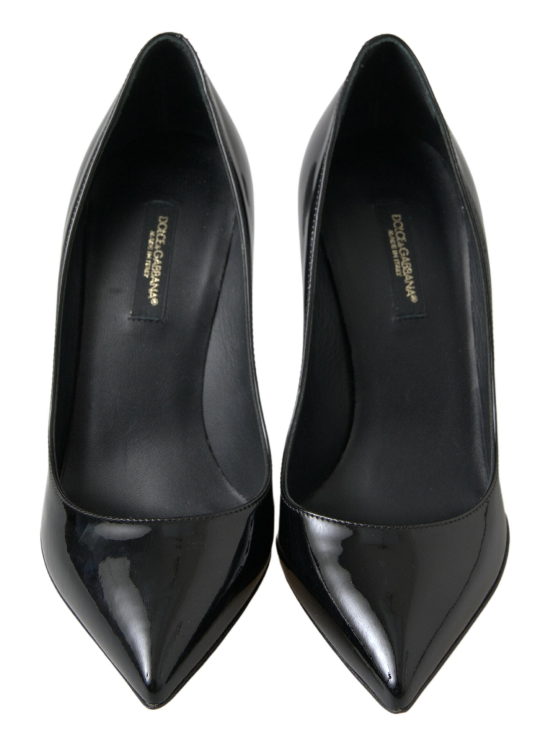 Pair of black high heel shoes with pointed toe and stiletto heels