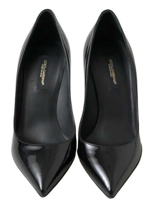 Pair of black high heel shoes with pointed toe and stiletto heels