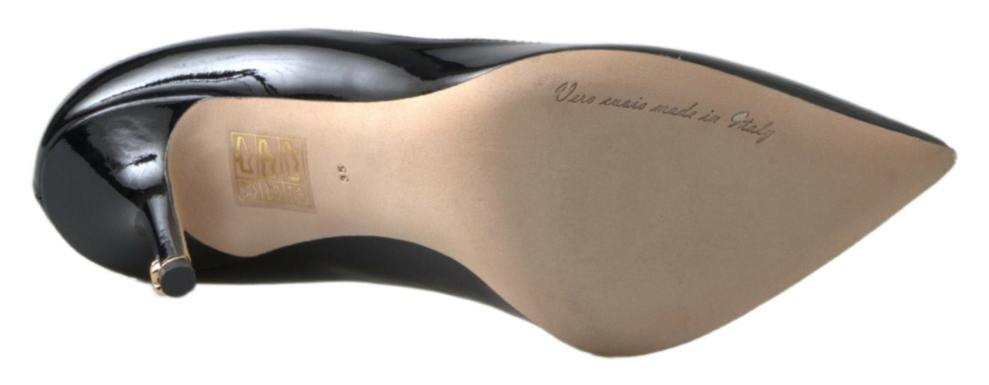 Tan shoe with black heel and toe, featuring a tag on the tongue