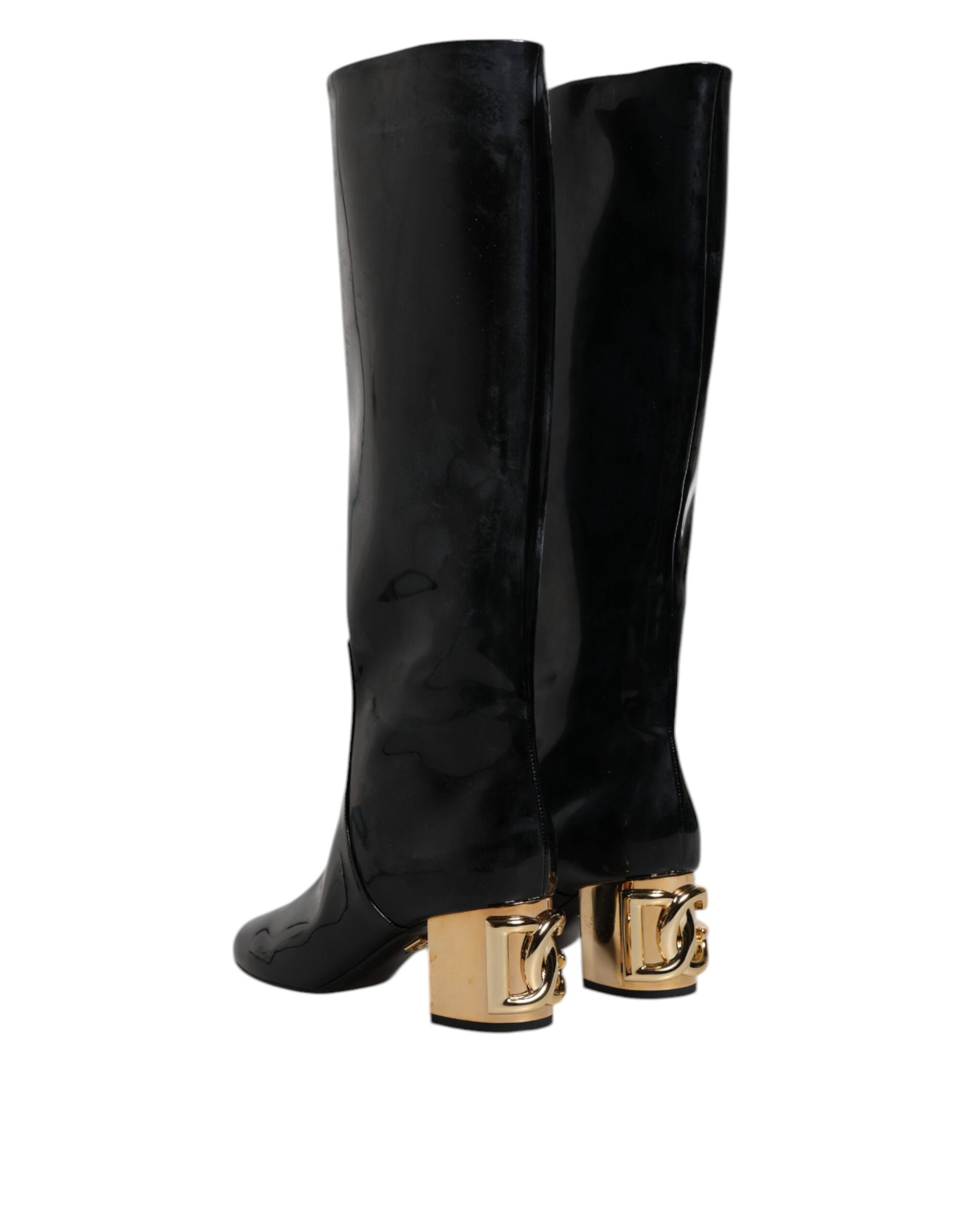Black knee high boots with gold buckles