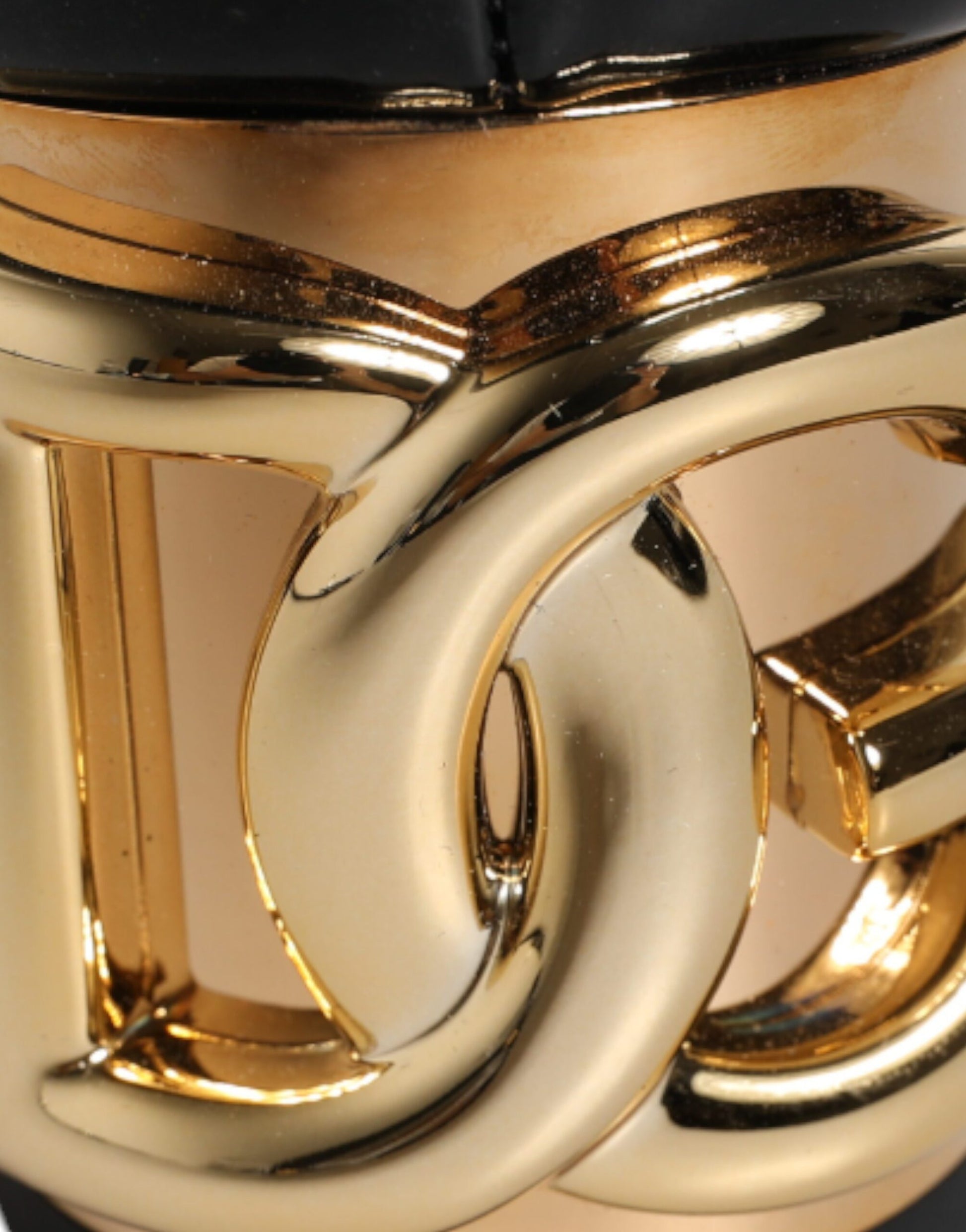 Gold cup with intertwined letters