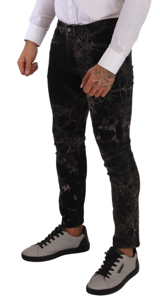 Man wearing black pants and white shirt