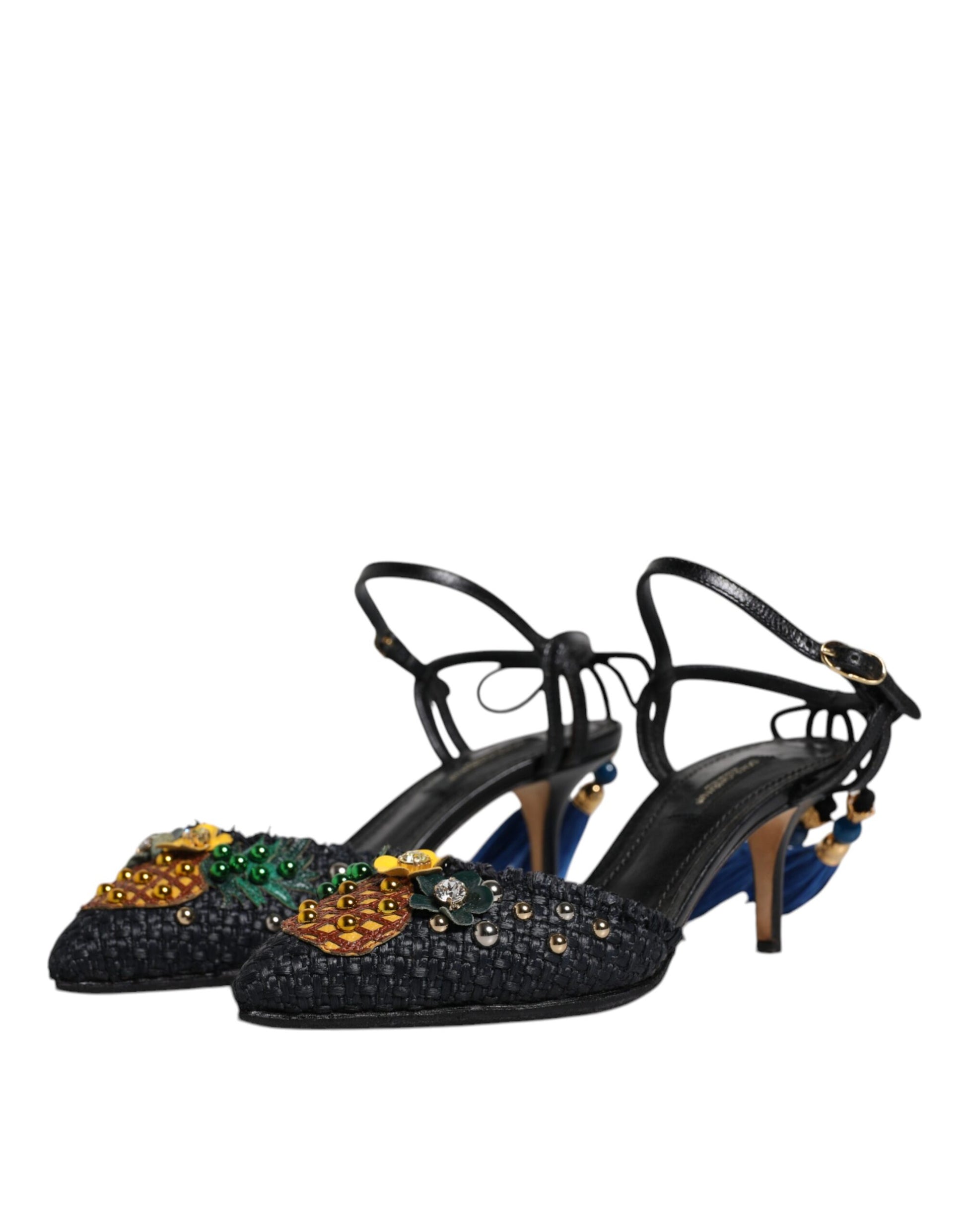 Pair of black high heel shoes with embellishments on top