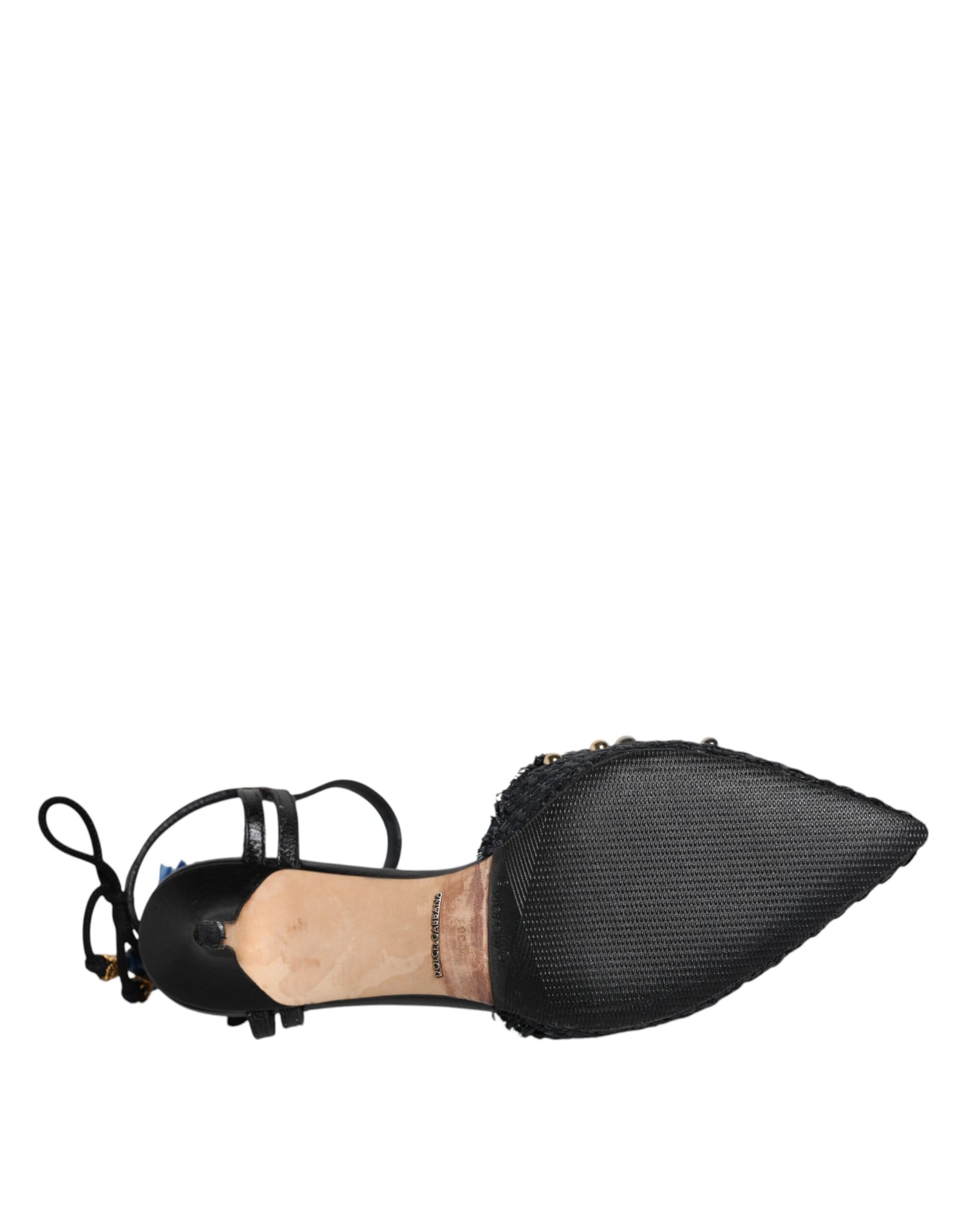 Black shoe with a strap over the foot