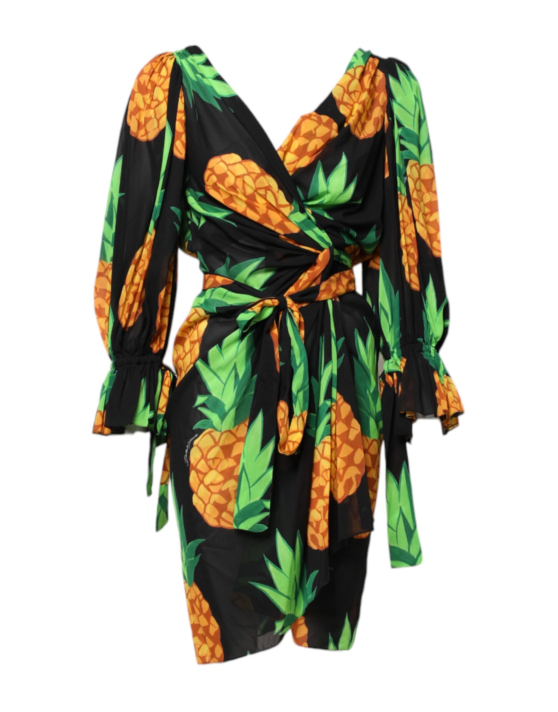 A black pineapple print silk wrap mini dress with a tie at the waist