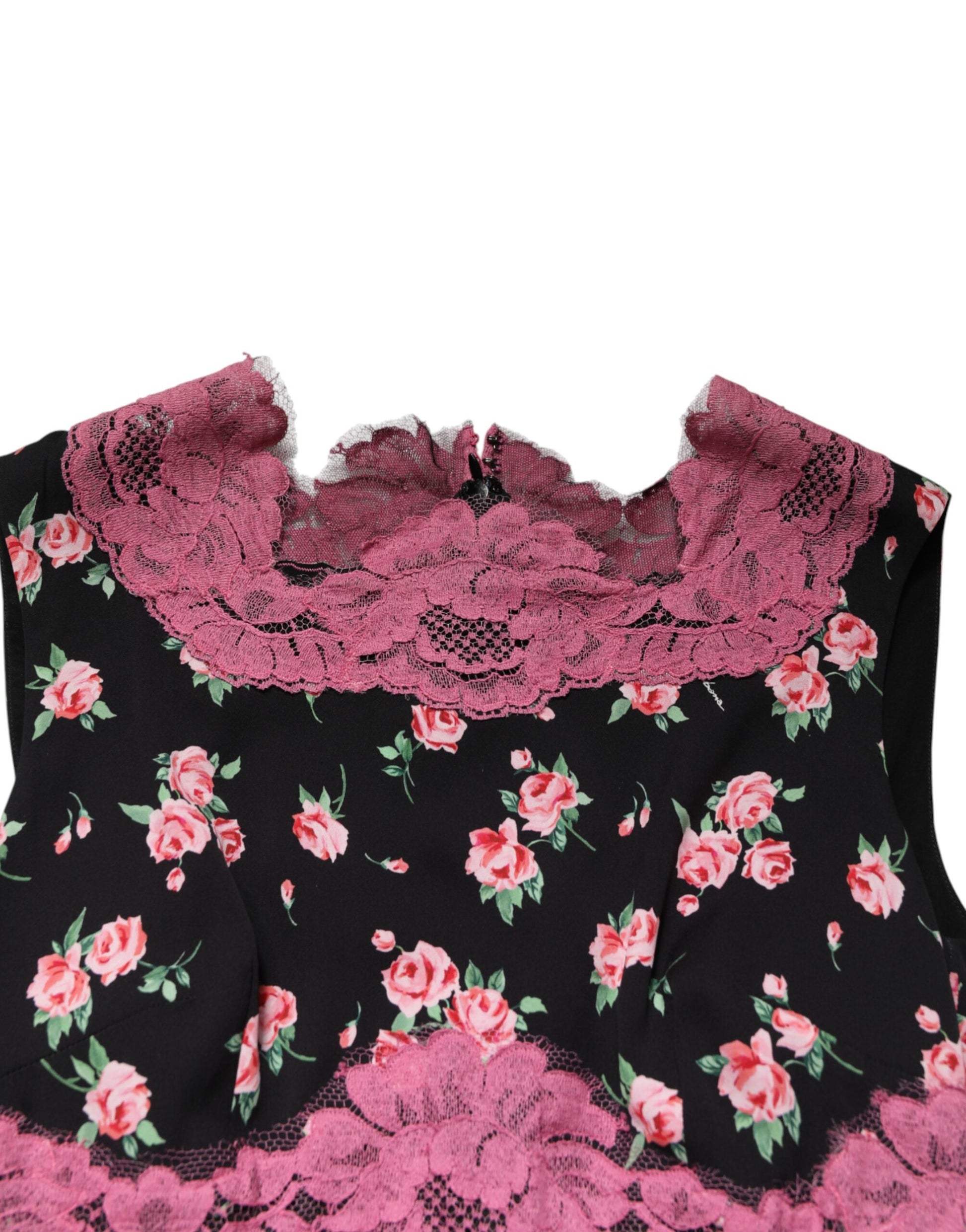 A black dress with pink floral lace and silk detailing