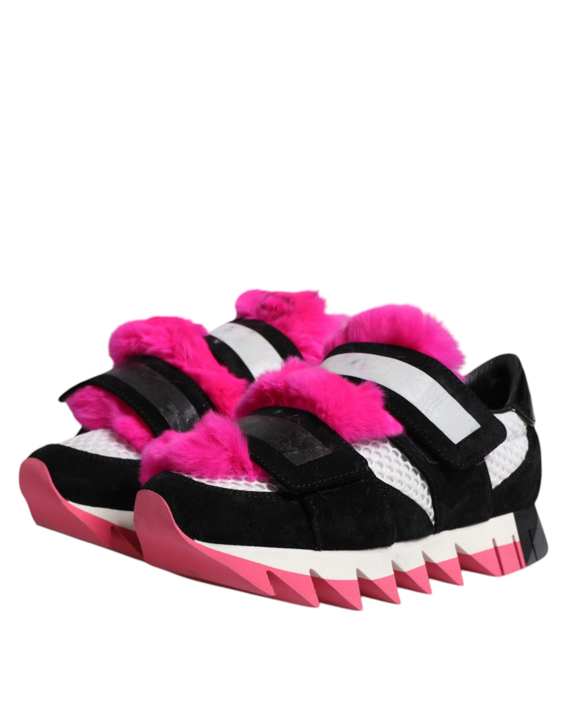 Pair of black pink fur embellished sneakers with white stripes and a strap