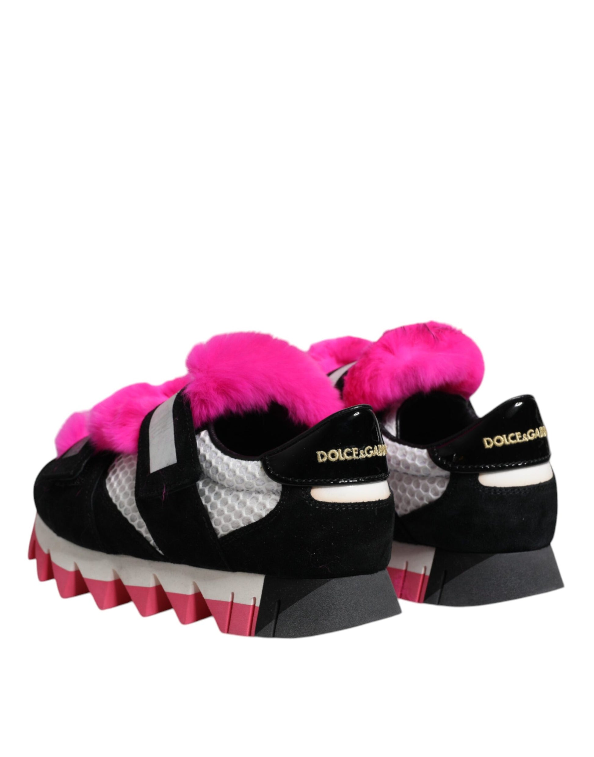 A pair of black pink fur-embellished sneakers with a gold logo on the side