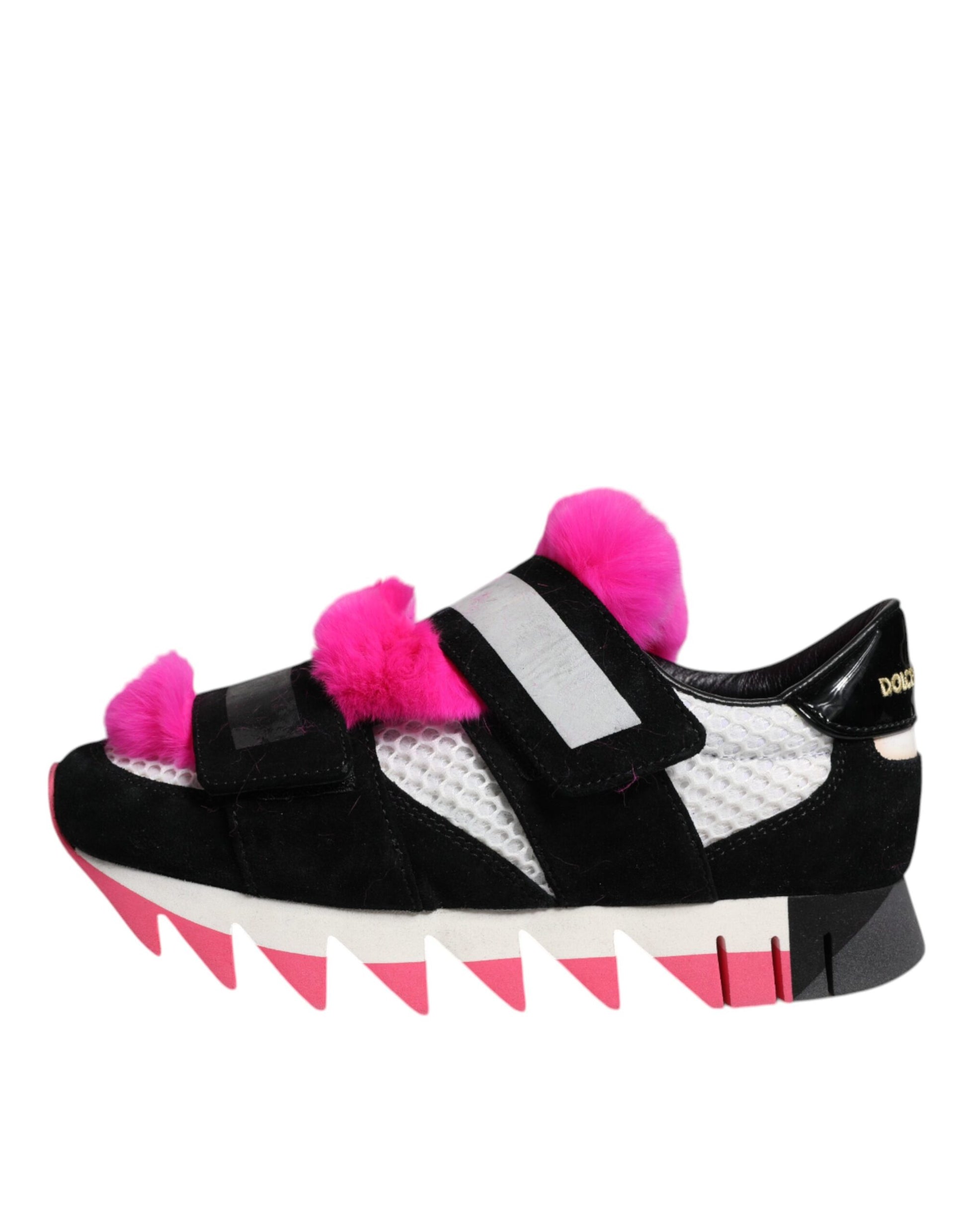 A pair of black, pink, and white sneakers with fur embellishments