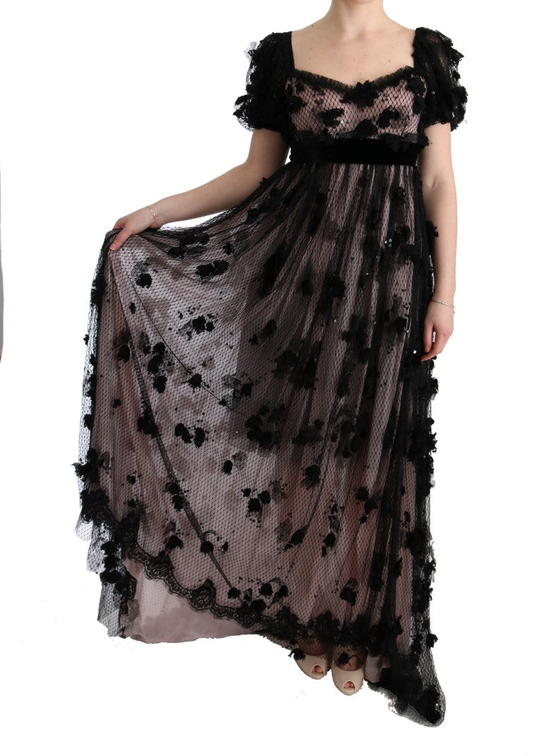 Long black lace dress with ruffles on sleeves and hem