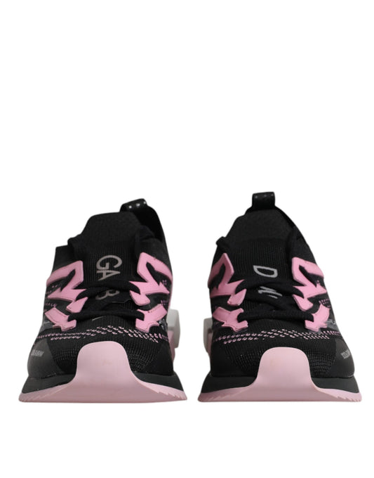Pair of black and pink sneakers with white laces, branded logo on side