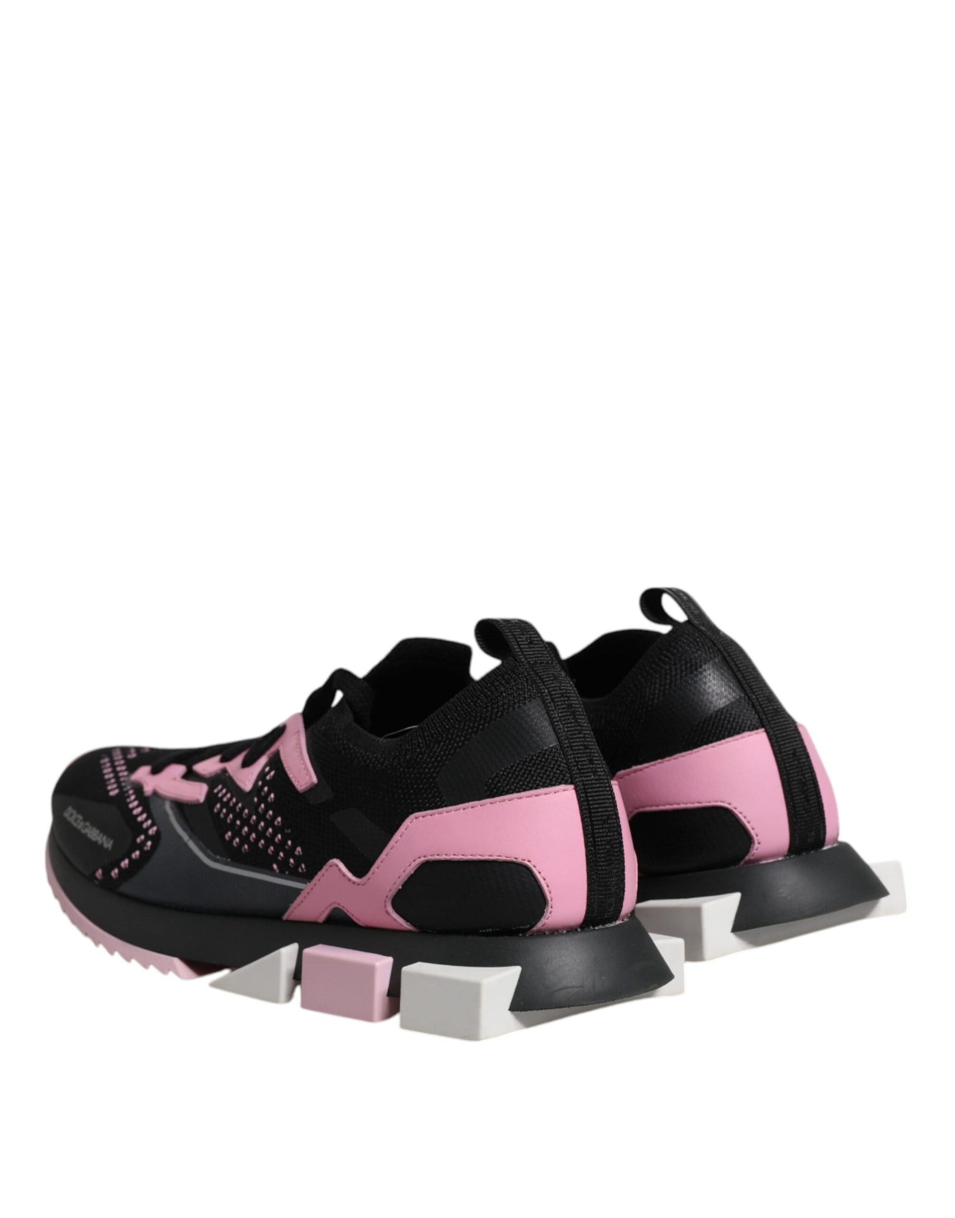 Pair of black and pink sneakers with white soles, featuring a stretchy design