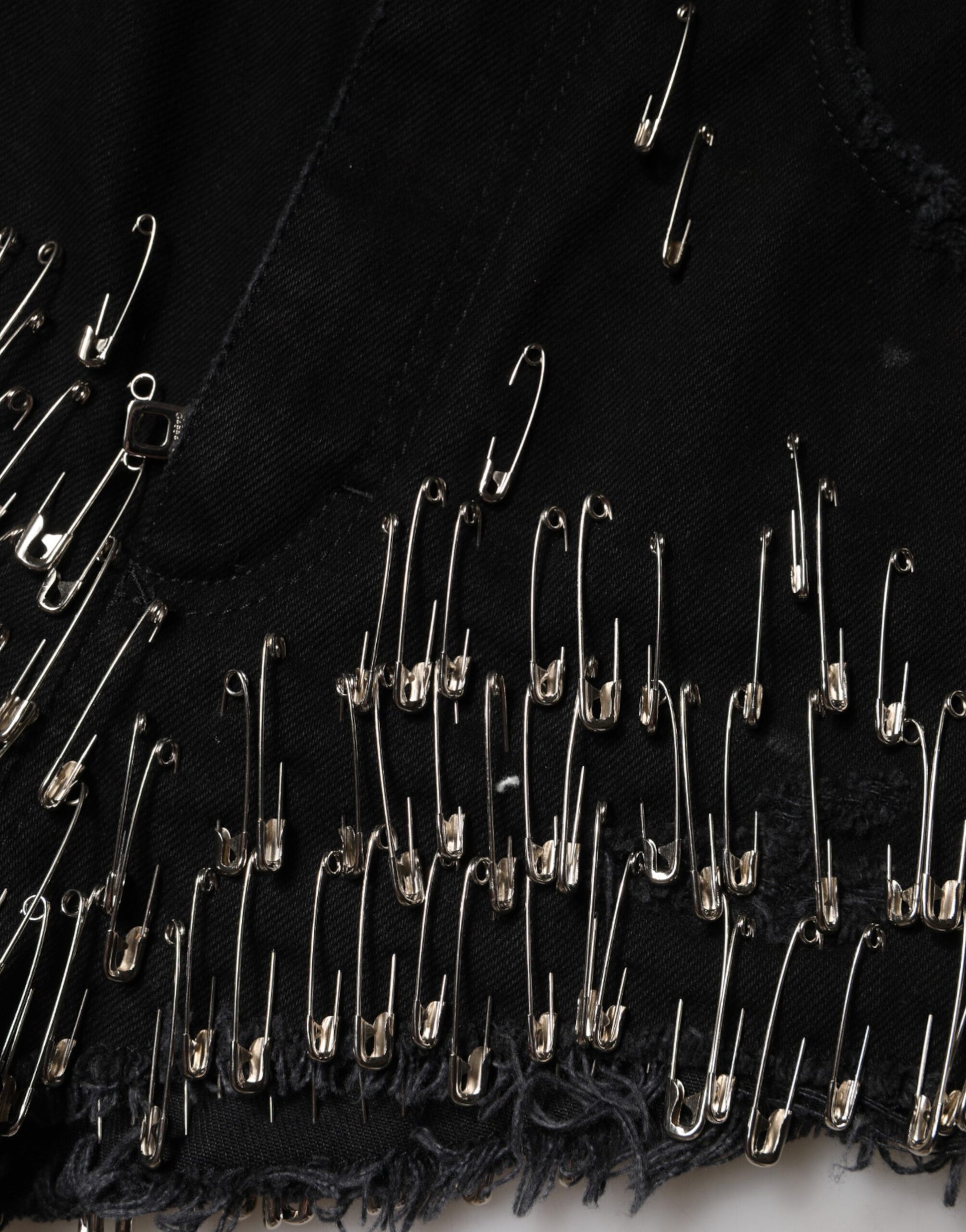 Black fabric with gold pins