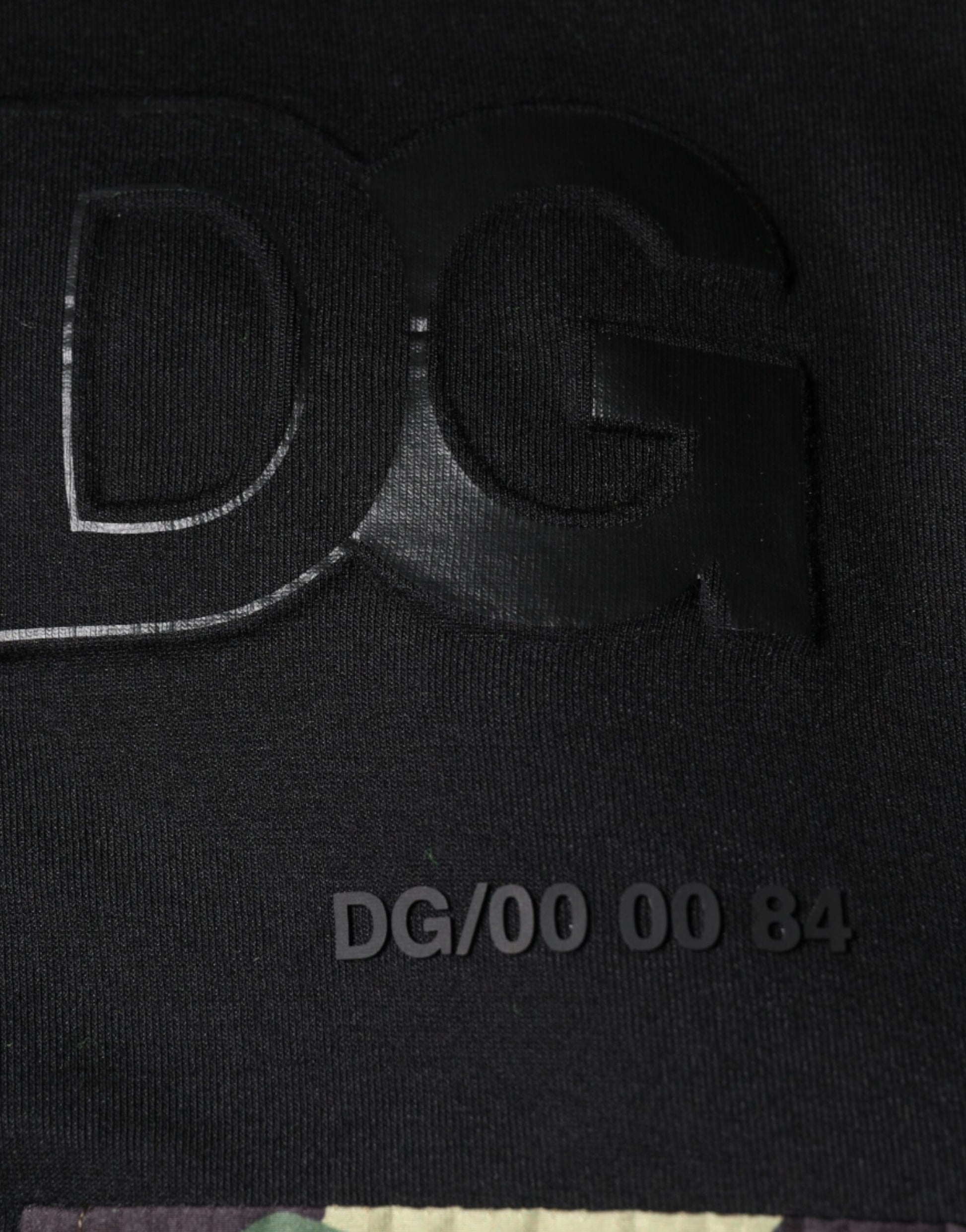 Black fabric with white embroidered letters and numbers