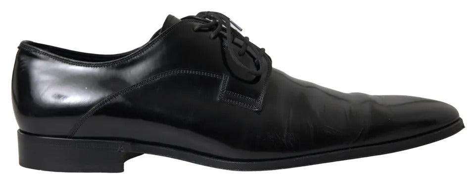 Pair of black polished leather formal dress shoes with laces and a small heel