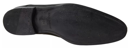 A pair of black polished leather formal dress shoes by Dolce & Gabbana
