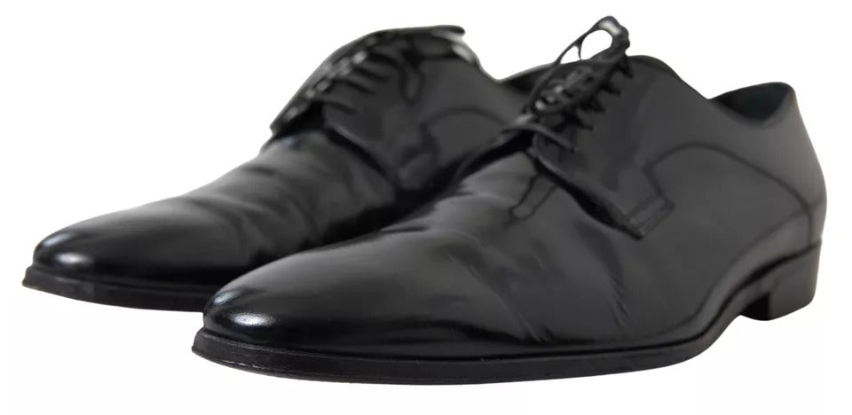 Pair of black polished leather formal dress shoes with laces and a shiny finish
