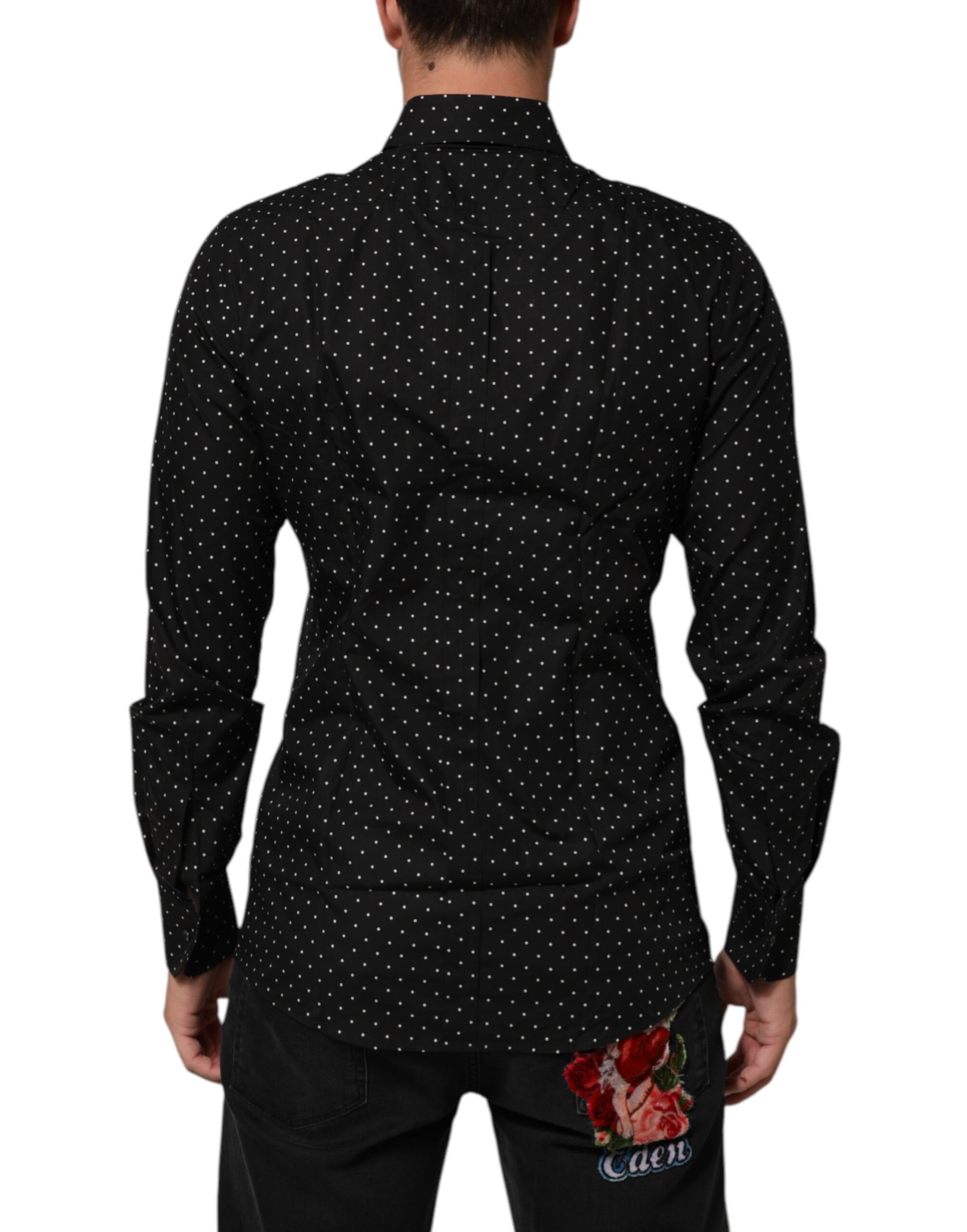 A black polka dot dress shirt with a gold collar and cuffs