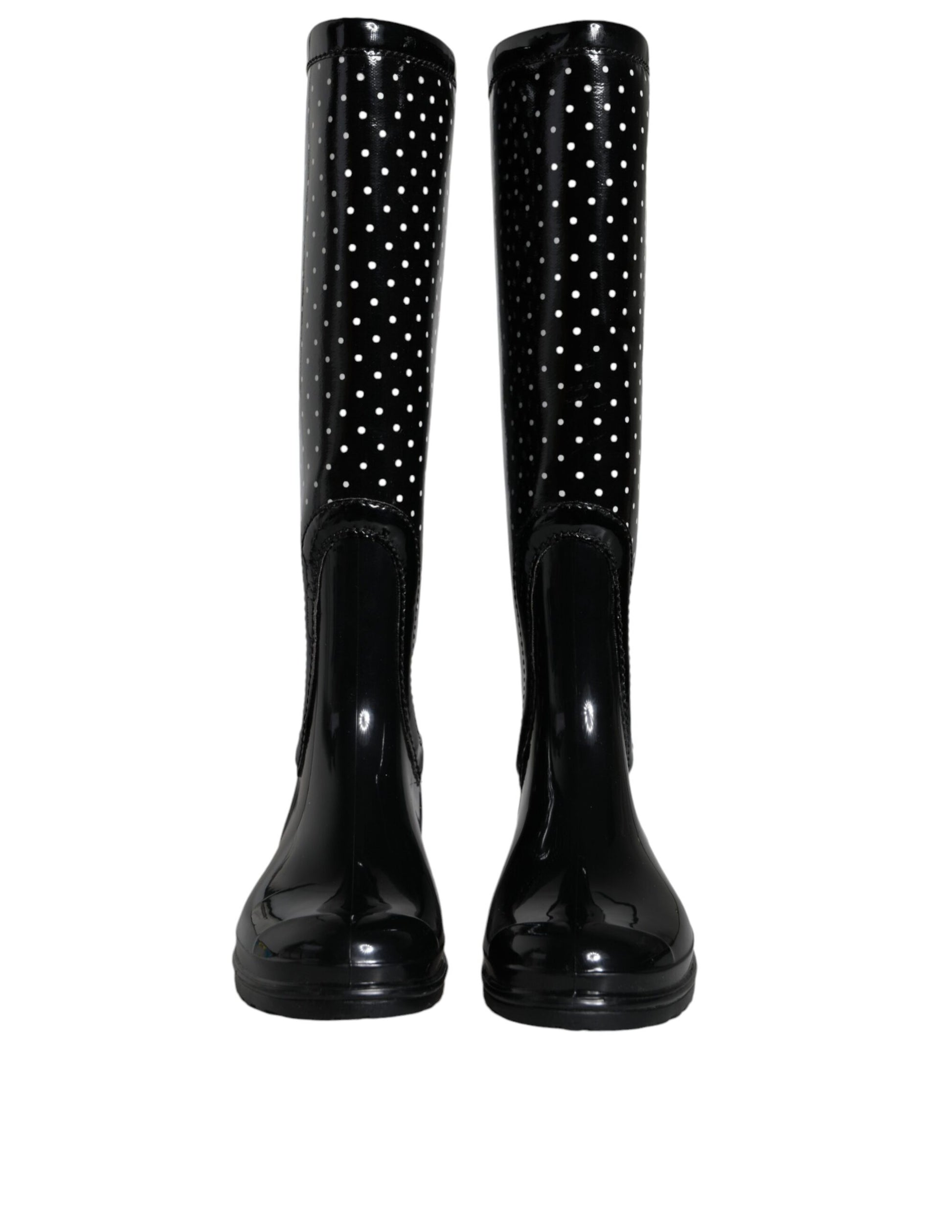 Pair of black rain boots with polka dots