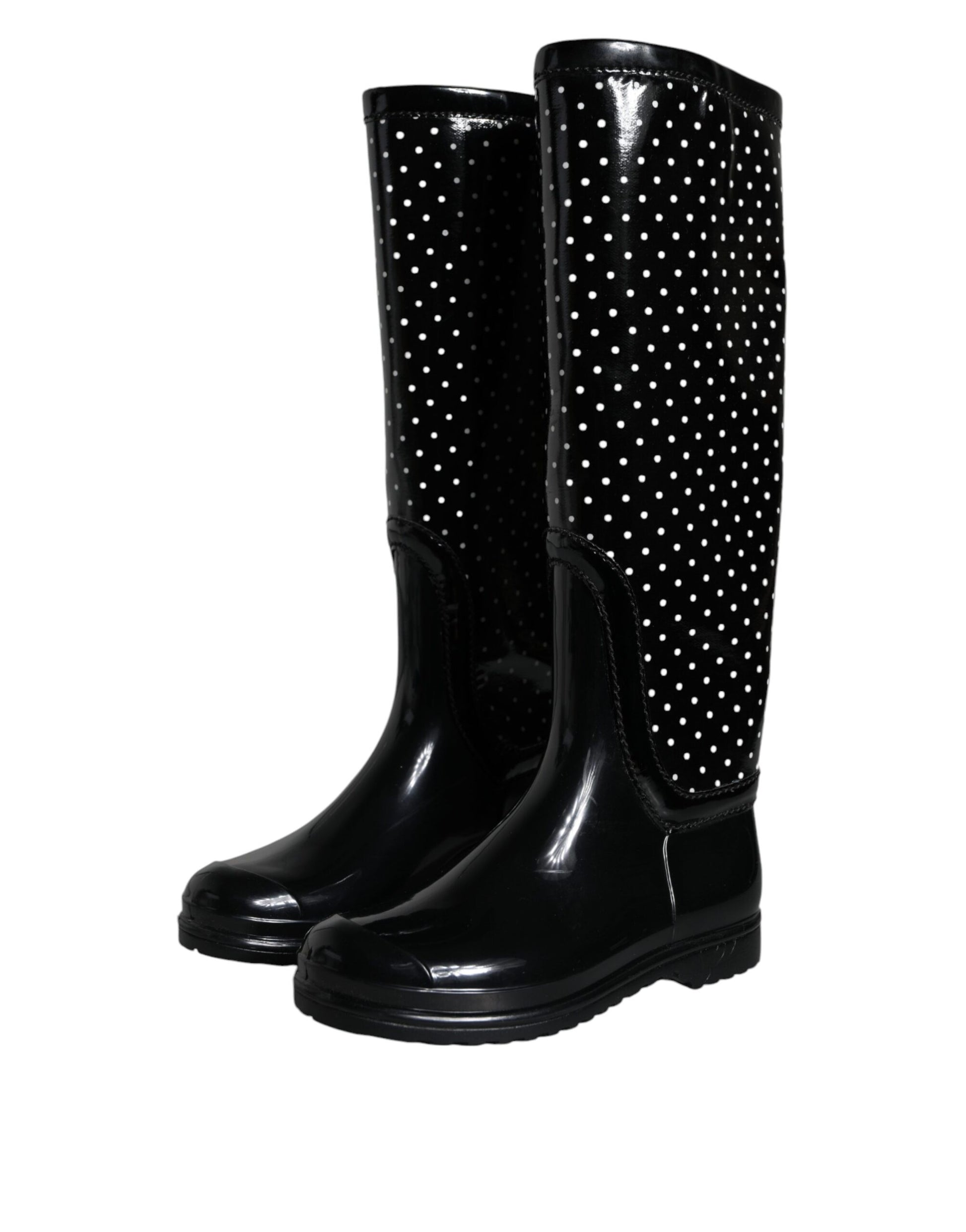 Pair of black rain boots with white polka dots
