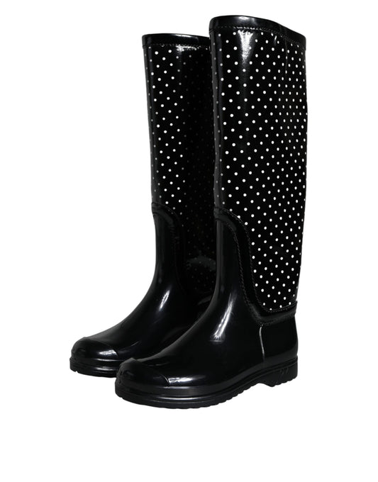 Pair of black rain boots with white polka dots