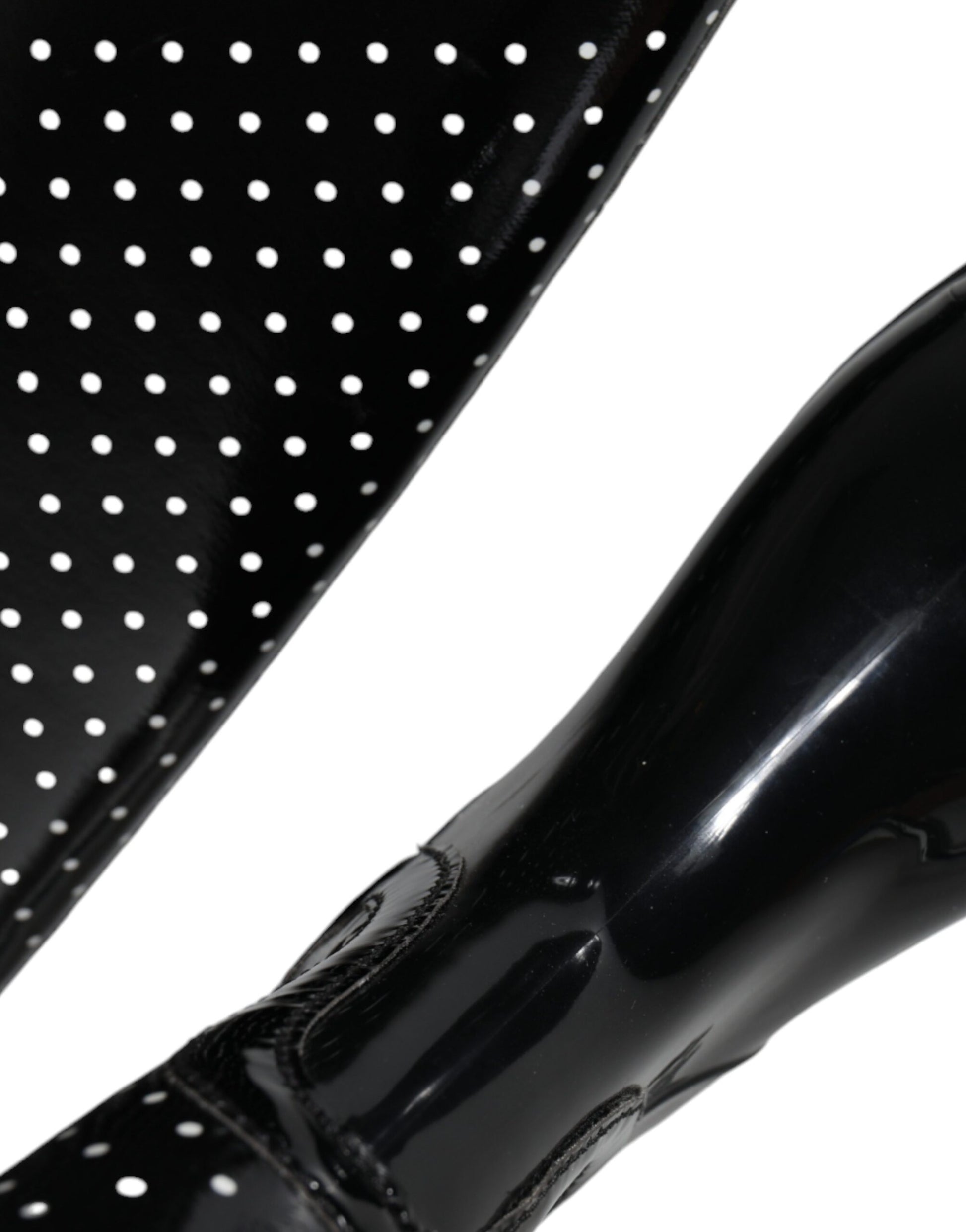 Black rain boot with polka dots on side