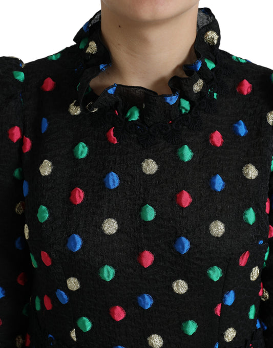 A black midi dress with polka dots and ruffles, featuring a cotton fabric
