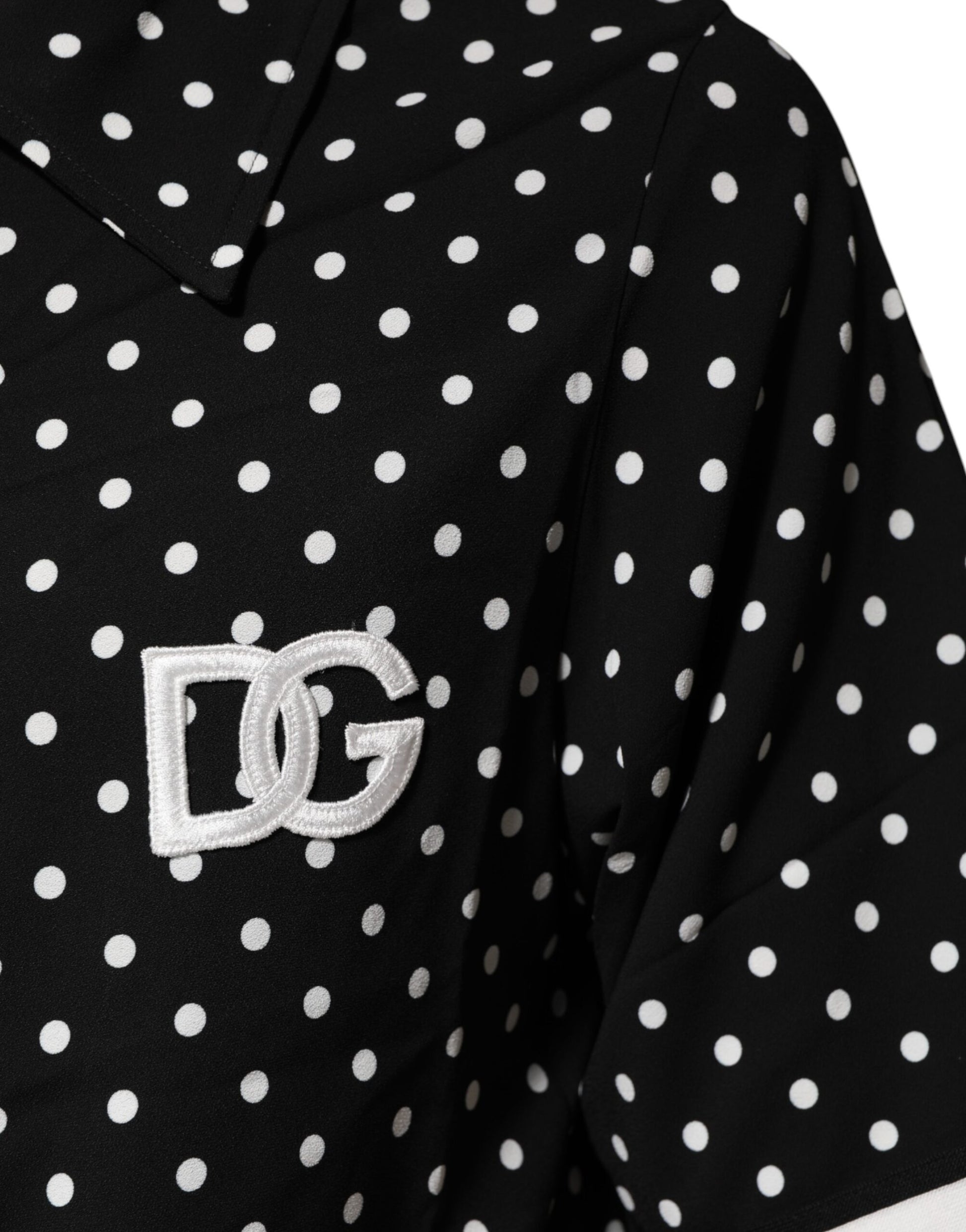 Black polka dot shirt with white letters DG on front