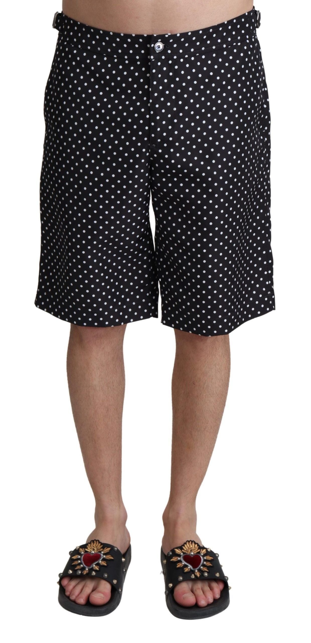 Black polka dot swim trunks on a mannequin