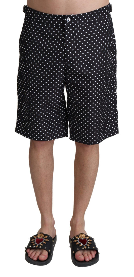 Black polka dot swim trunks on a mannequin