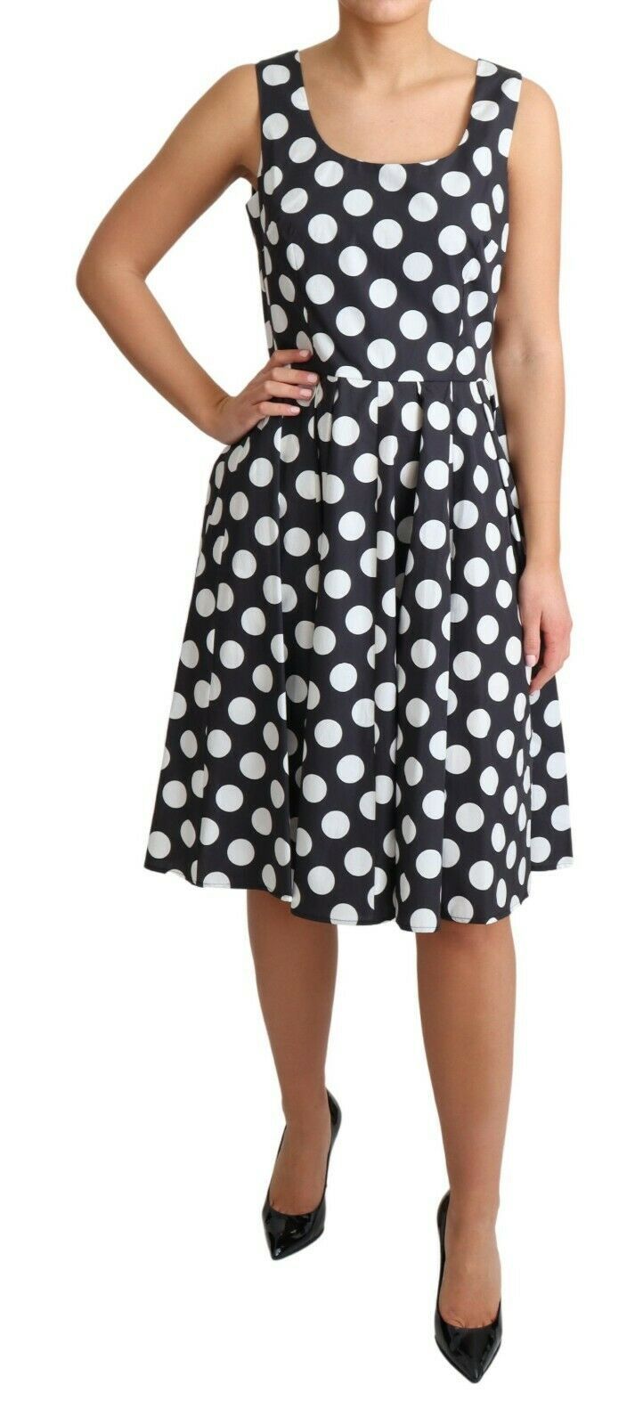 A black polka dotted cotton dress with an A-line silhouette