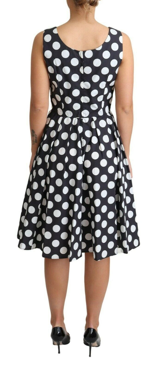 A black polka dotted cotton dress with an a-line skirt