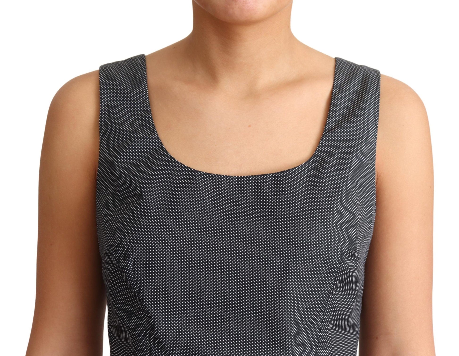 A black polka dotted cotton dress with an A-line silhouette