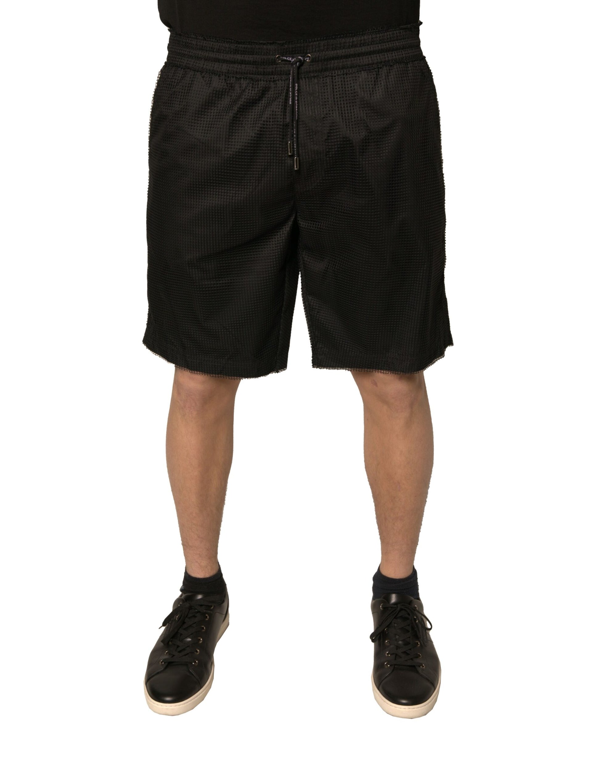 Men's black polyester jersey mid waist shorts with zippered front pocket