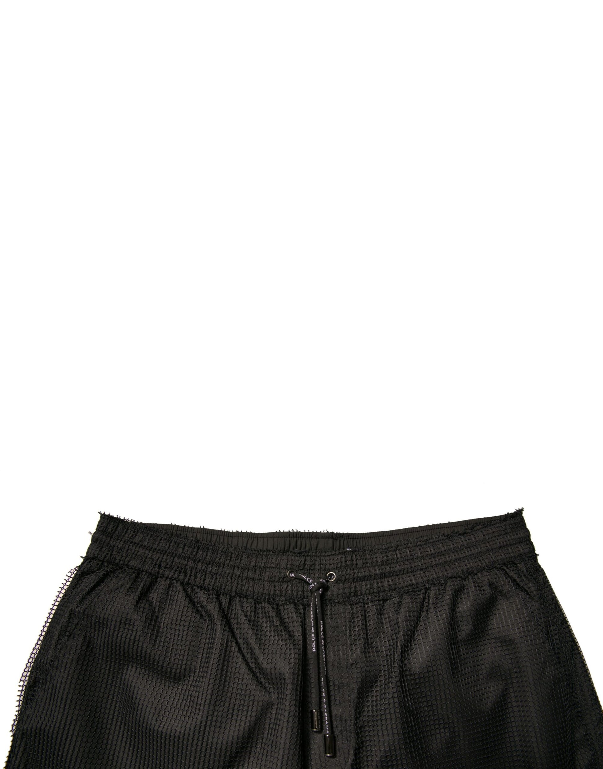Black polyester jersey mid waist shorts with drawstring closure