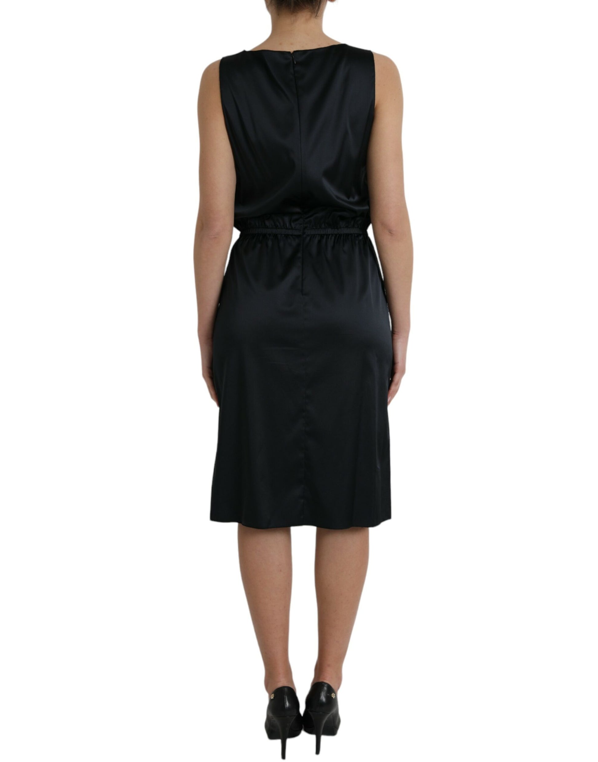 A black midi dress with lace trim and a V-neckline