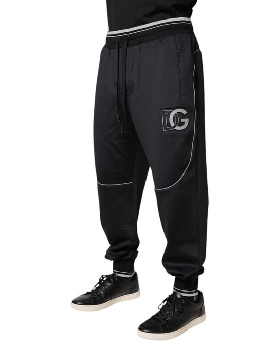 Black tracksuit pants with white stripe and logo on side