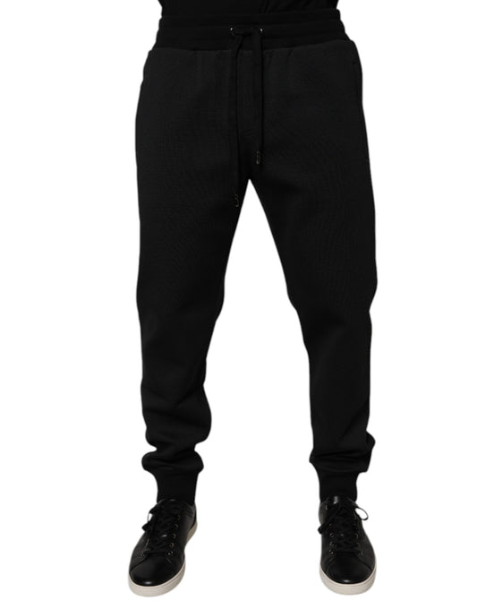 Black sweatpants with a patterned design on the legs